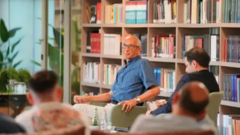 Prof. Dr. Cemil Koçak delivering his lecture on the July 15 coup attempt at the Institute Social Library, addressing a full audience. Photo by the Institute Social