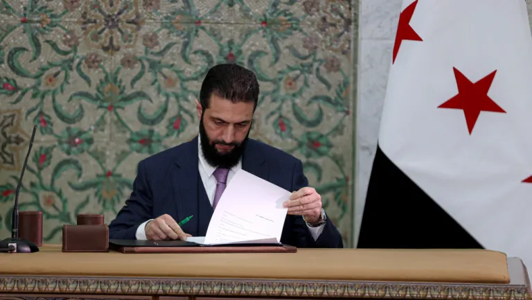 Syrian President Ahmed al-Sharaa signs interim constitutional declaration in Damascus